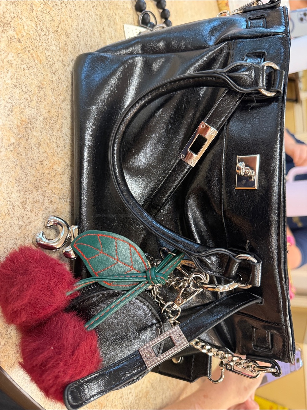 Black Leather Tote Handbag with Red Pom Charm